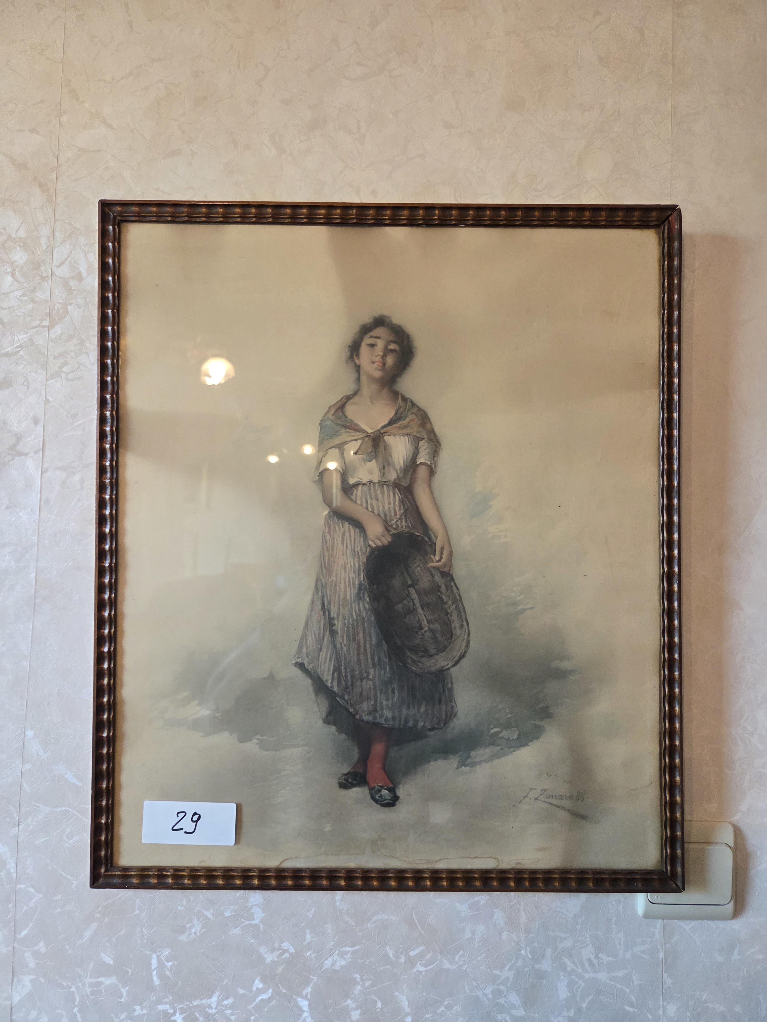 Ingekaderde prent van een staande jonge vrouw met een mand, gesigneerd J. Zonis lot 29 – kavel bij Goeiendeal, Jette