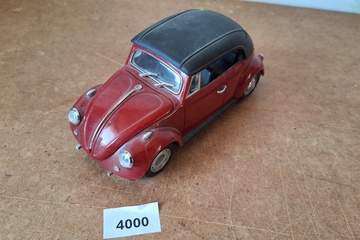 Afbeelding van VW kever modelauto/telefoon