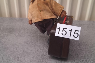 Afbeelding van Blikken speelgoed popje met koffer