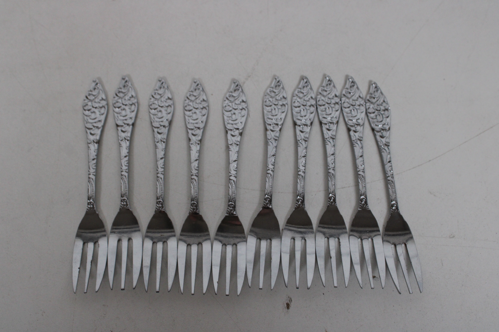 Set van 10 kleine vorkjes met decoratieve handgrepen – foto 2 – kavel bij GSD Auctions, Zoeterwoude