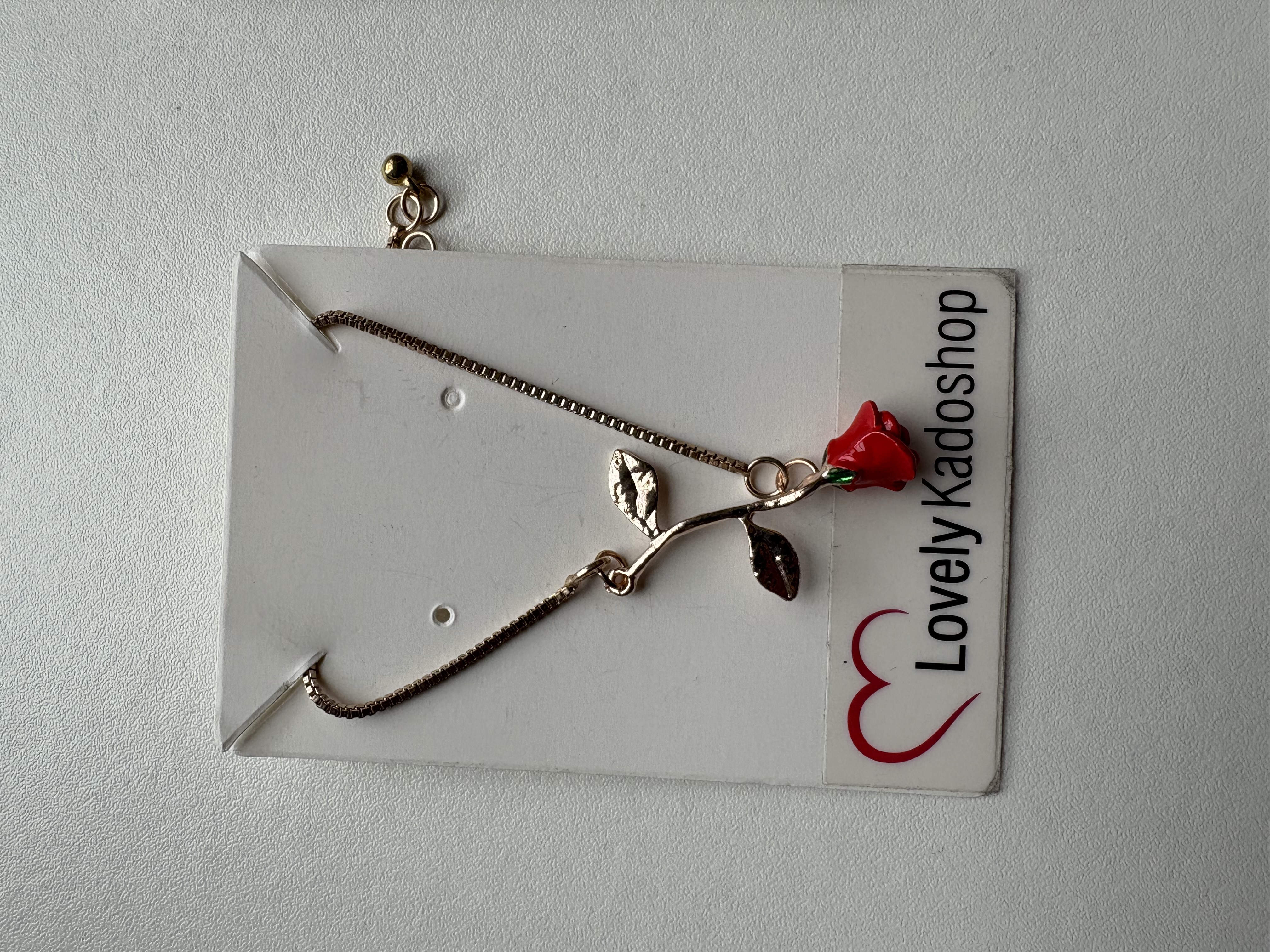 Roos ketting en armband goudkleurig – foto 2 – kavel bij GSD Auctions, Zoeterwoude