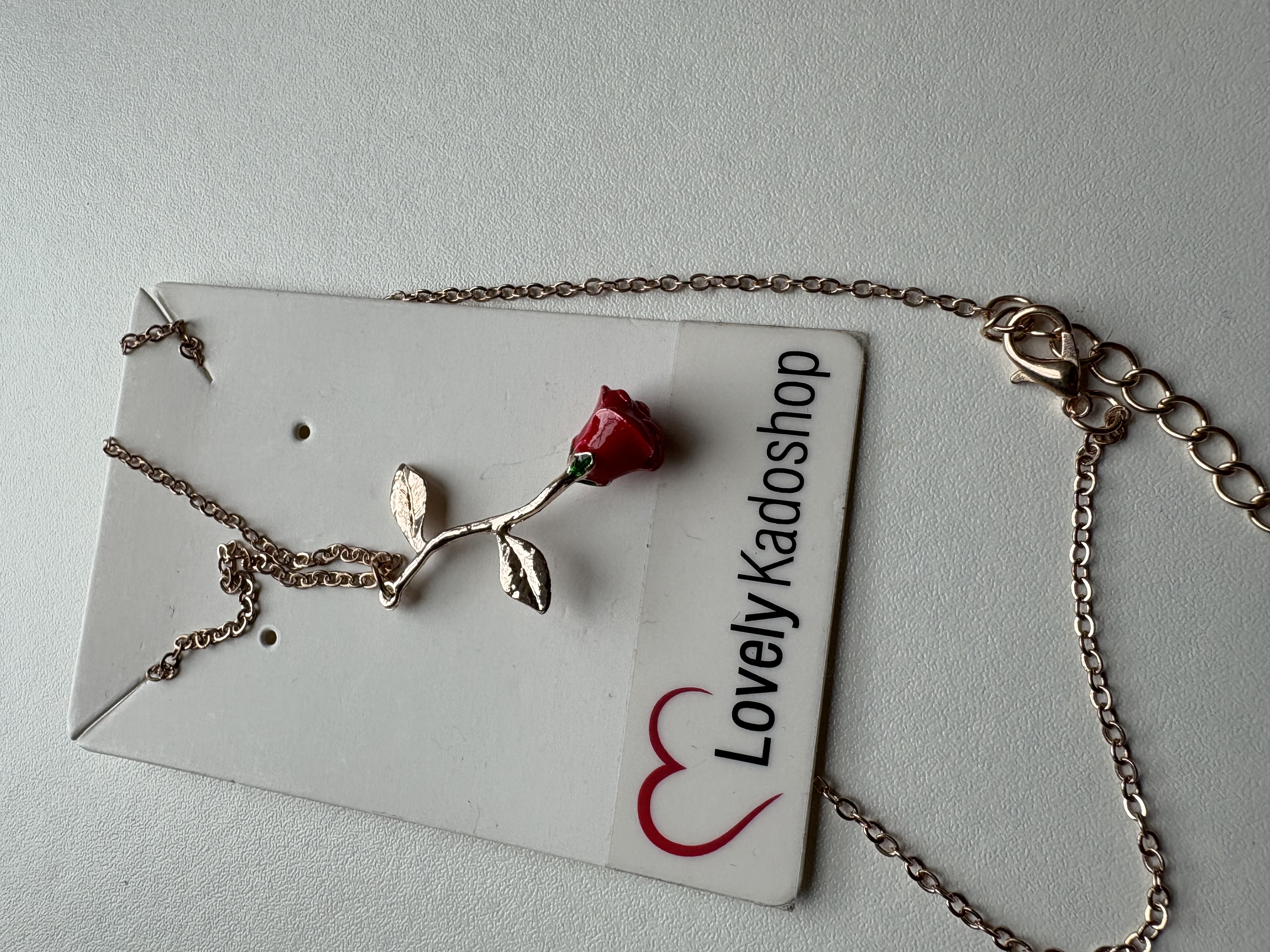 Roos ketting en armband goudkleurig – foto 3 – kavel bij GSD Auctions, Zoeterwoude