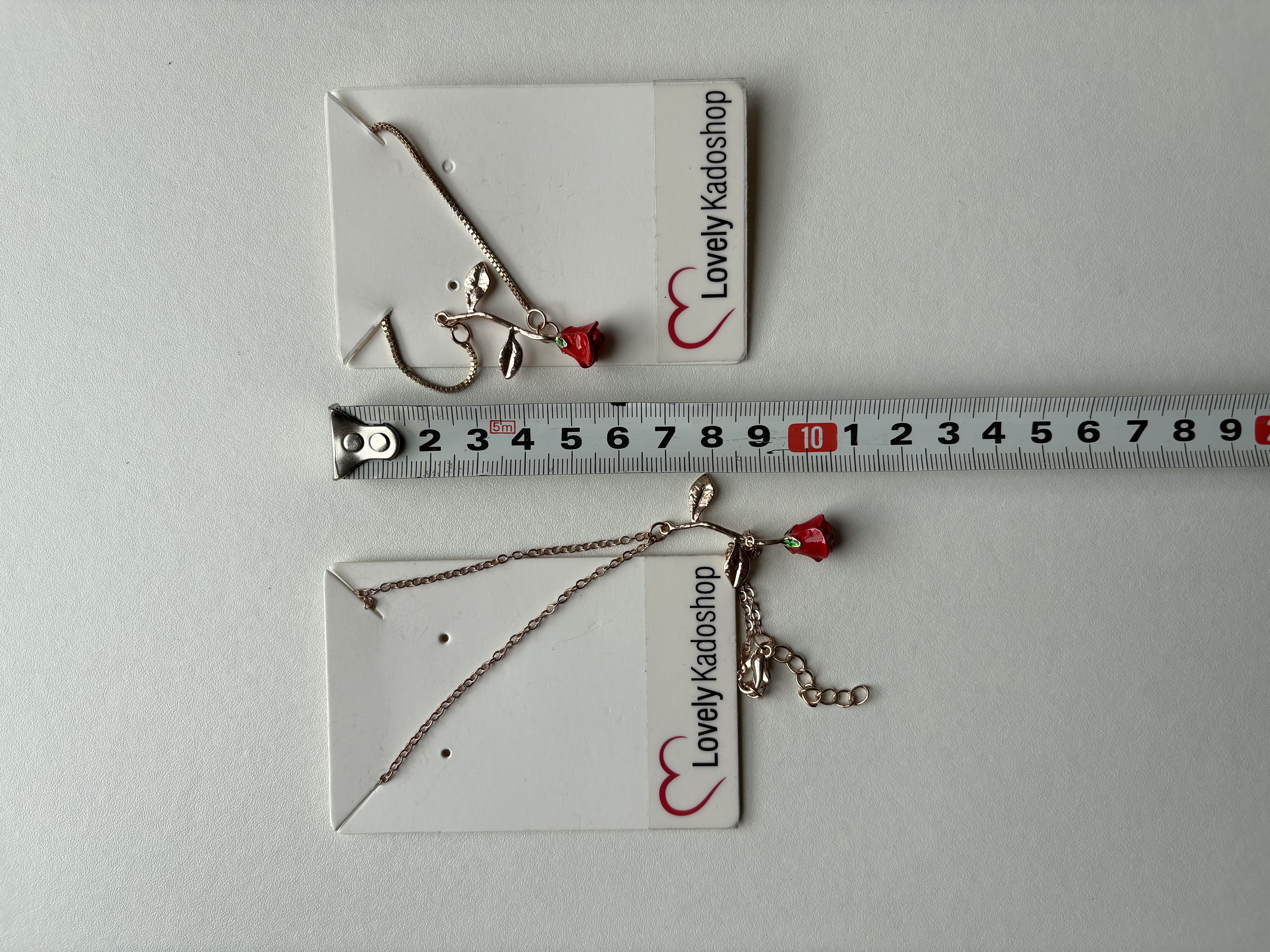 Roos ketting en armband goudkleurig – foto 5 – kavel bij GSD Auctions, Zoeterwoude