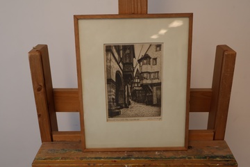 Afbeelding van Ingelijste zwart-wit ets van straatbeeld''