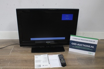 Afbeelding van Televisie met afstandsbediening en handleidingen